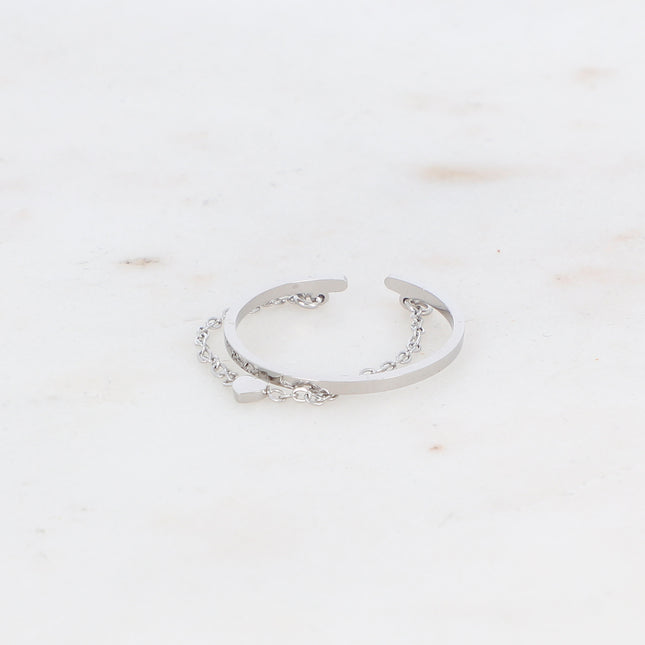 Ring with twisted band and heart on a dangling chain