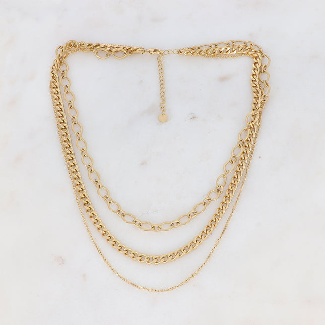 Three-strand necklace with curb links and textured ovals