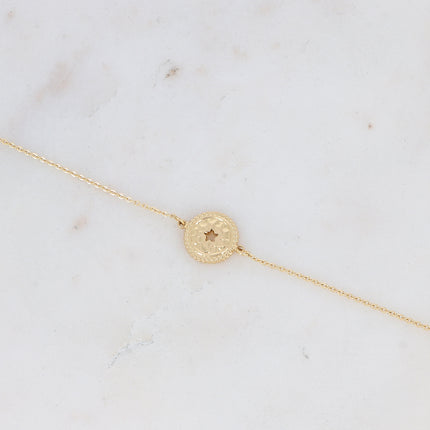 Bracelet with hammered pendant and openwork star