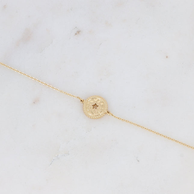 Bracelet with hammered pendant and openwork star