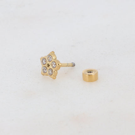 Piercing avec fleur et oxydes de zirconium