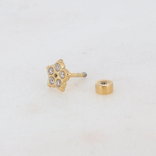 Piercing avec fleur et oxydes de zirconium