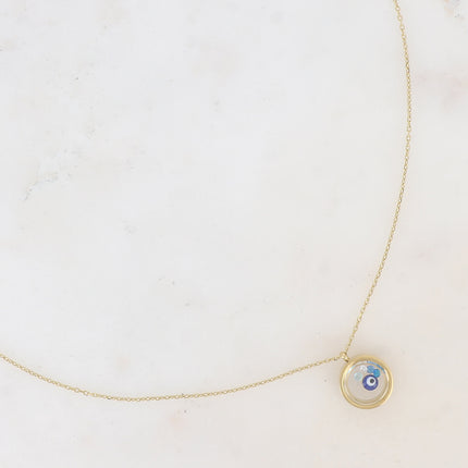 Collier - médaillon avec cristaux taillés et pastille oeil