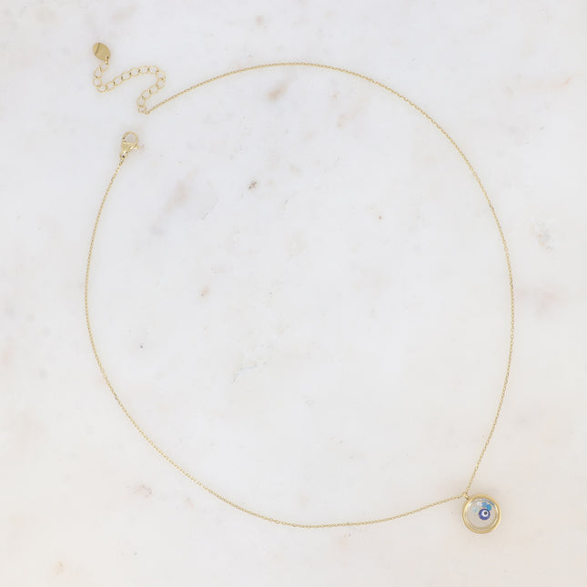 Collier - médaillon avec cristaux taillés et pastille oeil