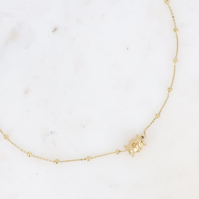 Collier Lula - chaîne à boules, pendentif en forme de cylindre traversant aux ronds incurvés