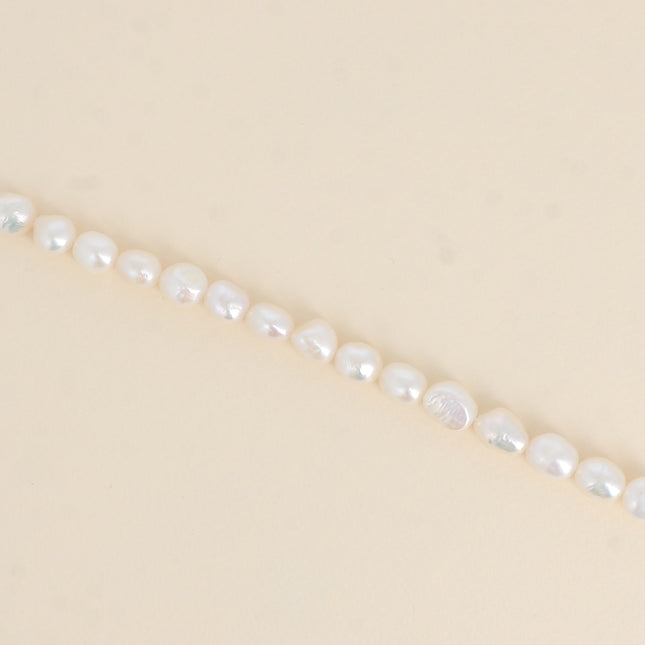 Bracelet sur cordon - perles d'eau douce 8mm