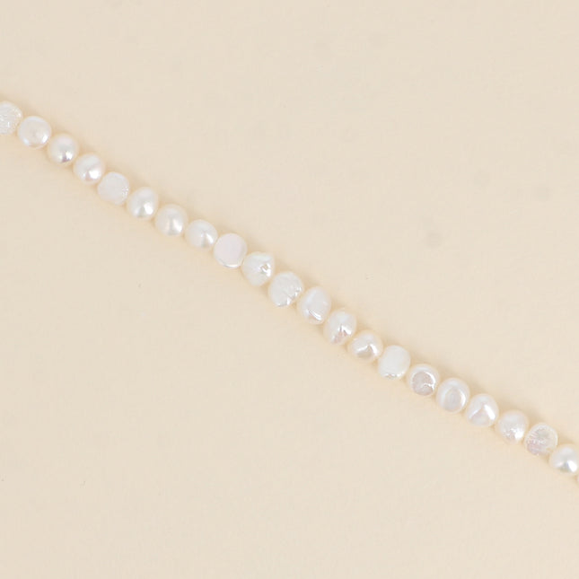 Bracelet sur cordon - perles d'eau douce 6mm