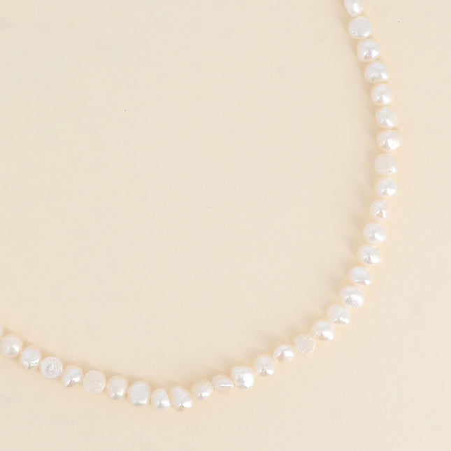 Collier sur cordon - perles d'eau douce 6mm