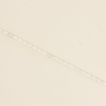 Bracelet sur cordon - perles d'eau douce allongées