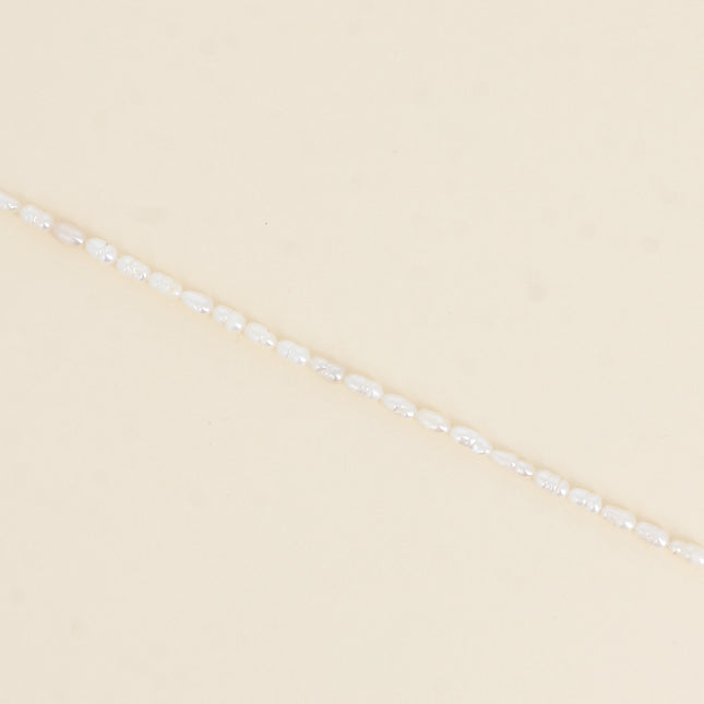 Bracelet sur cordon - perles d'eau douce allongées