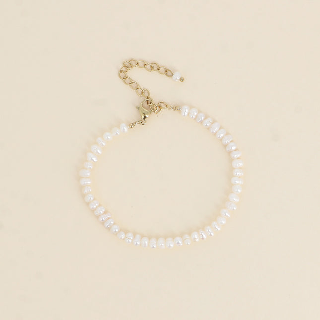 Bracelet sur cordon - perles d'eau douce 3 mm
