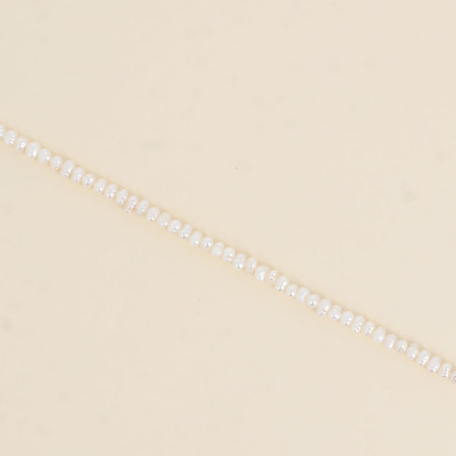Bracelet sur cordon - perles d'eau douce 3 mm