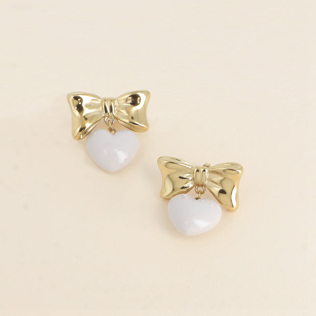Boucles pendantes Ariadna - noeud papillon et coeur pendant en acétate