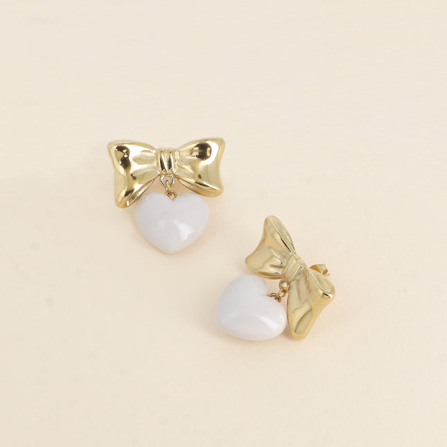 Boucles pendantes Ariadna - noeud papillon et coeur pendant en acétate
