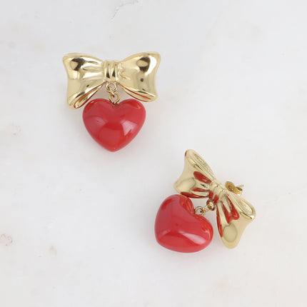 Boucles pendantes Ariadna - noeud papillon et coeur pendant en acétate