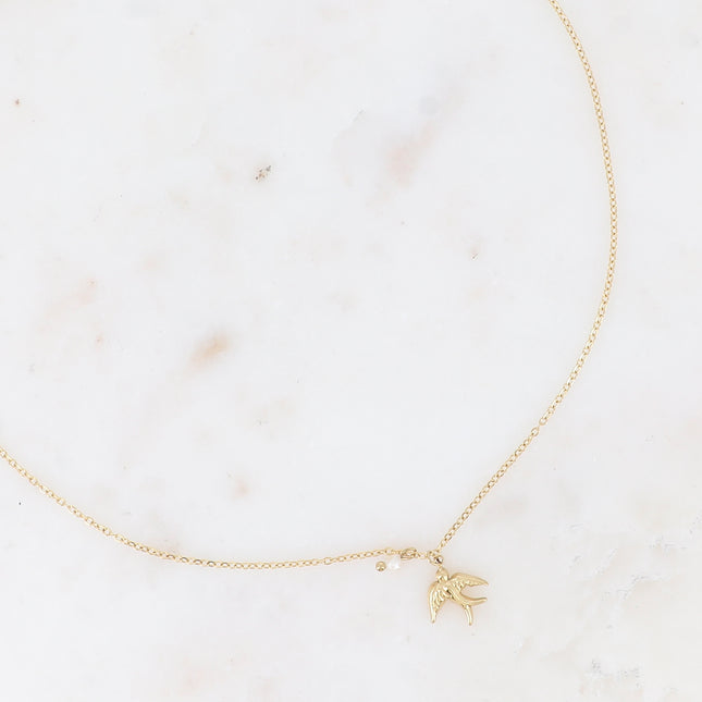 Necklace - a bird in flight and a small freshwater pearl
