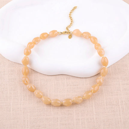 Collier sur cordon Sixtine - grosses perles en résine colorée