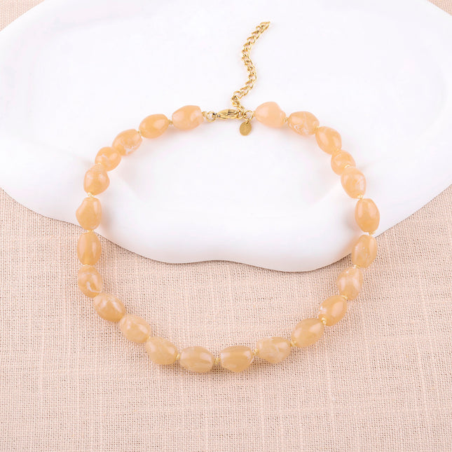 Collier sur cordon Sixtine - grosses perles en résine colorée