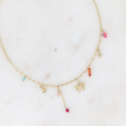 Collier - breloques (noeud papillon, coeur, pâtes de verre et losange avec cristaux)