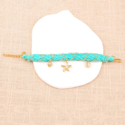 Maracya cord bracelet - buoy clasp and marine charms (seashells, starfish and cowrie shells)