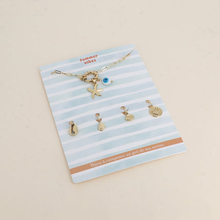Cartelette SUMMER VIBES Bracelet et 6 pendentifs (oeil en émail et étoile de mer)