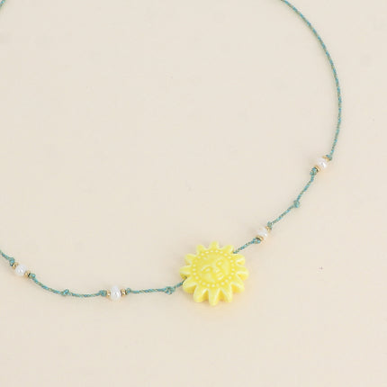 Collier sur cordon - ras de cou, perles d'eau douce et soleil en céramique émailée