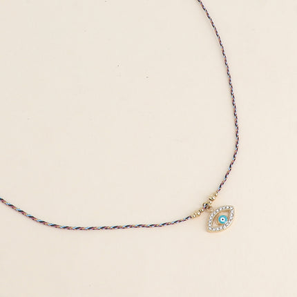 Collier sur cordon - oeil émaillé et oxydes de zirconium