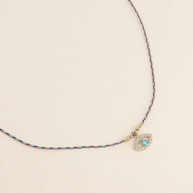 Collier sur cordon - oeil émaillé et oxydes de zirconium