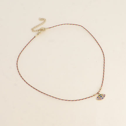 Collier sur cordon Isola - oeil ajouré et oxydes de zirconium
