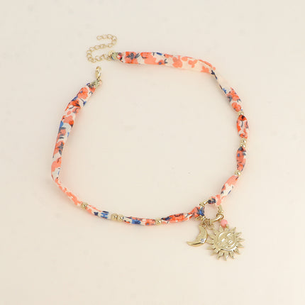 Collier - tissu, fermoir bouée, 3 pendentifs (perle, éclipse soleil, lune et oxyde de zirconium)
