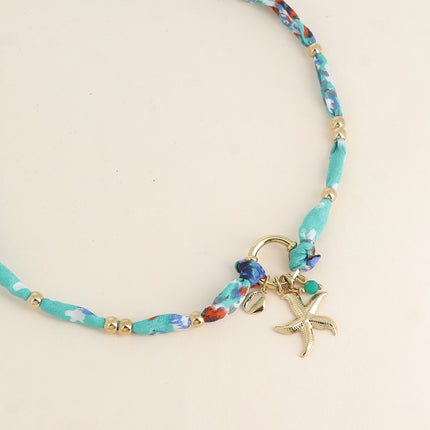 Collier Nerolia - tissu, fermoir bouée, 3 pendentifs (perle, étoile de mer, petit cauri)