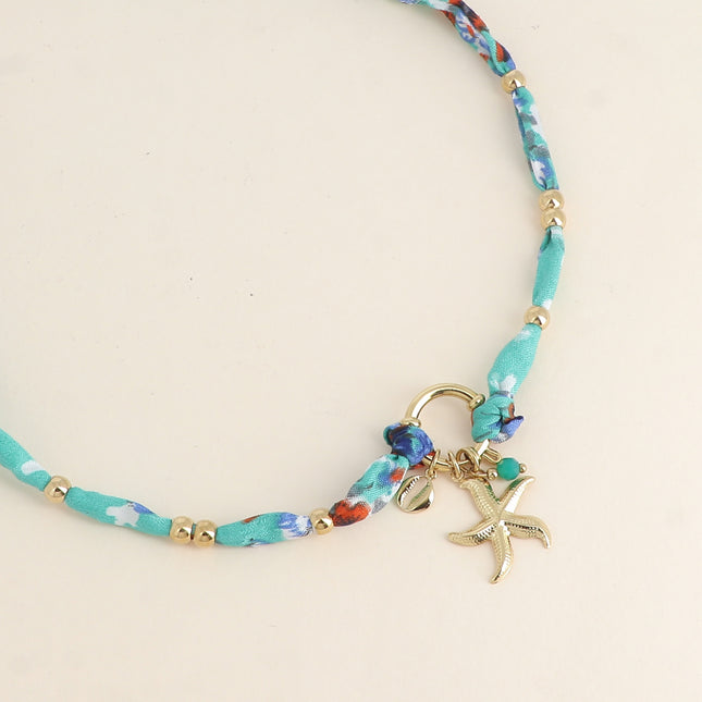 Collier Nerolia - tissu, fermoir bouée, 3 pendentifs (perle, étoile de mer, petit cauri)