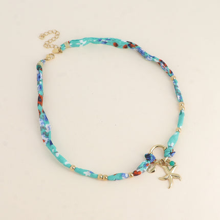 Collier Nerolia - tissu, fermoir bouée, 3 pendentifs (perle, étoile de mer, petit cauri)