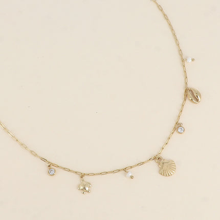 Collier - coquillage, cauri, tortue, perles d'eau douce et cristal