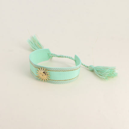 Bracelet coulissant Delphine - tissu et pièce soleil souriant