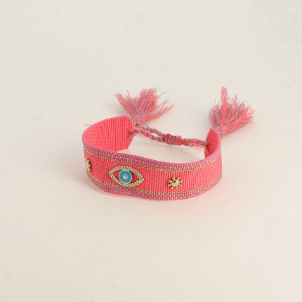 Bracelet en tissu coulissant - oeil en émail et oxydes de zirconium, pompons
