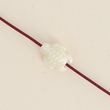 Perle tortue en céramique et émail