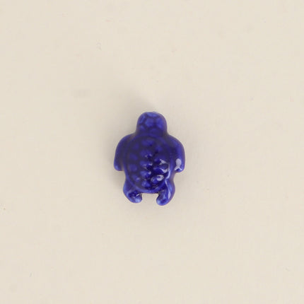 Perle tortue en céramique et émail