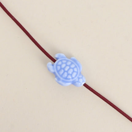 Perle tortue en céramique et émail