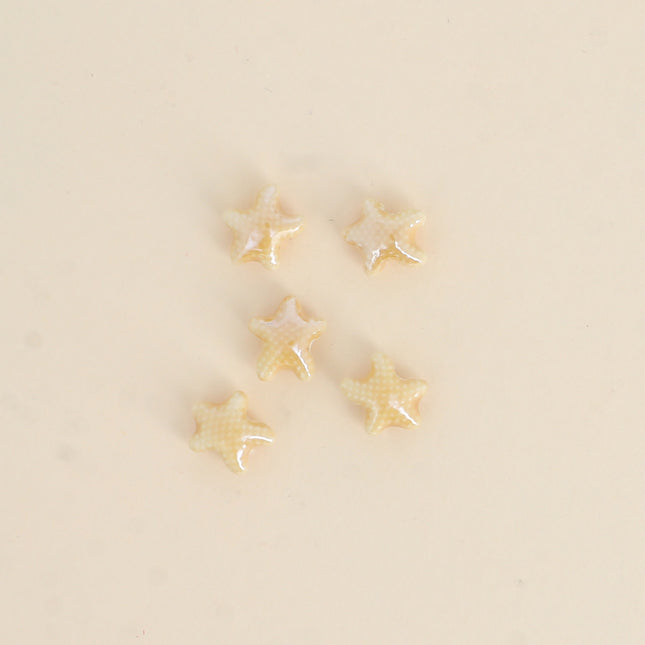 Perle étoile de mer XS en céramique et émail