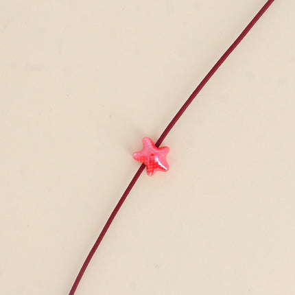 Perle étoile de mer XS en céramique et émail