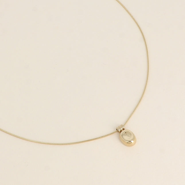 Necklace - pendant with a small, domed, and curved disc