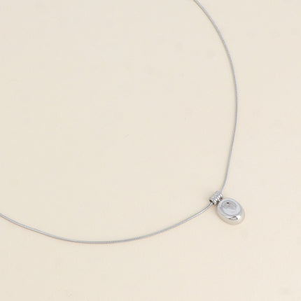Collier - pendentif petite pastille bombée et incurvée