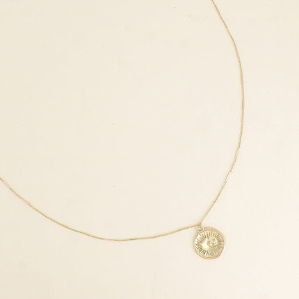 Collier - médaillon rond avec éclispe (lune, soleil, étoile)