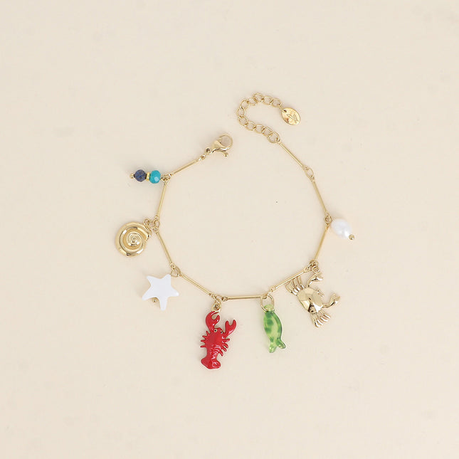 Bracelet Silena - crabe, homard en émail, étoile de mer nacrée, coquillage escargot, poisson en résine, perle d'eau douce et pierres naturelles