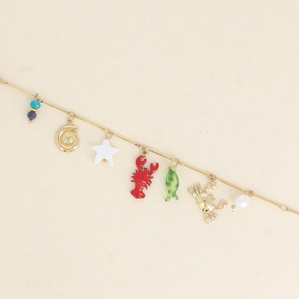 Bracelet Silena - crabe, homard en émail, étoile de mer nacrée, coquillage escargot, poisson en résine, perle d'eau douce et pierres naturelles