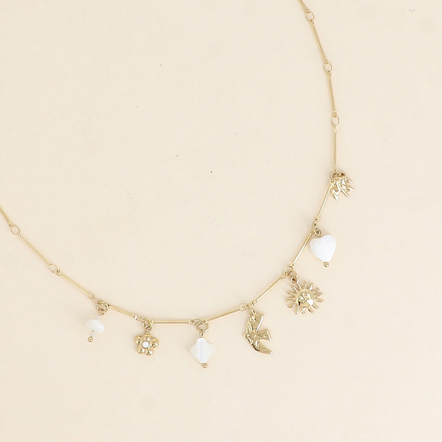 Meliora Necklace - mother-of-pearl sun, bird, clover and heart, flower