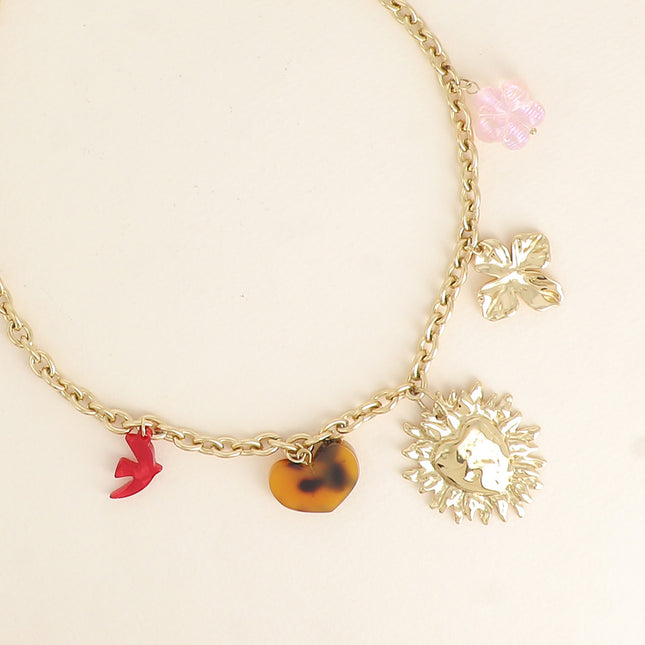 Kalyra Necklace - resin bird and heart, hammered heart, clover, flower bead