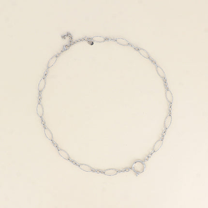 Collier - fermoir bouée, maillons alternés ovales dentelés, 3 petits maillons ovales