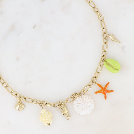 Collier - fleur nacrée, breloques marins (étoile de mer, tortue et cauri émaillés, coquillages)